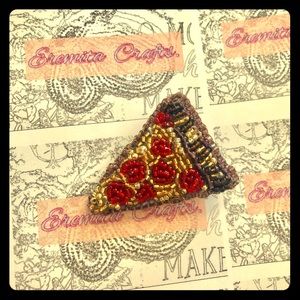 A pizza slice brooch